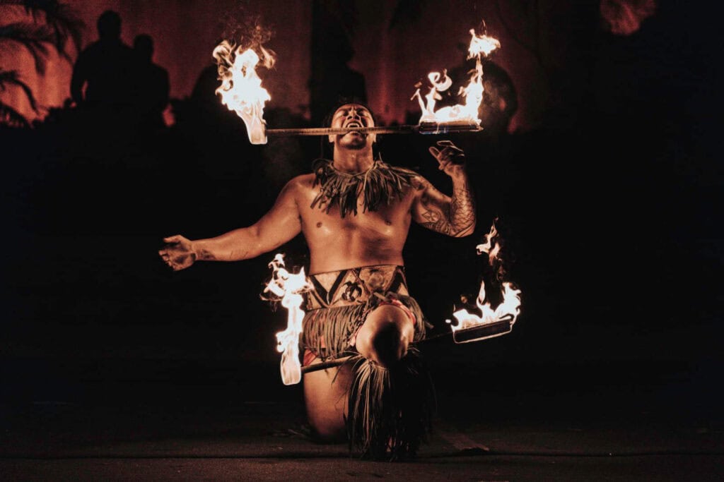 traditional hawaiian fire dance luau in polynesian cultural center.