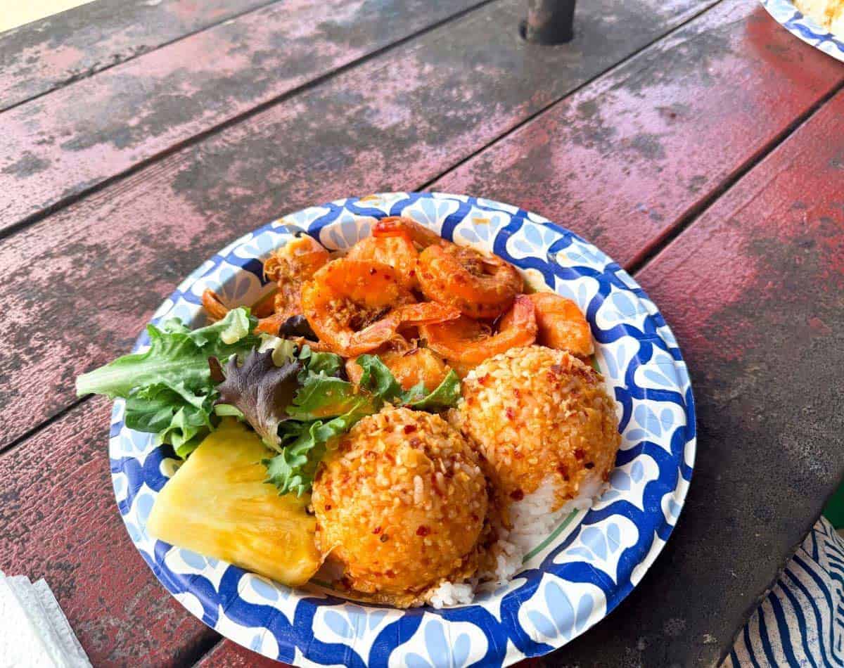 spicy garlic shrimp with rice and pineapple-a traditional staple local food in Hawaii.