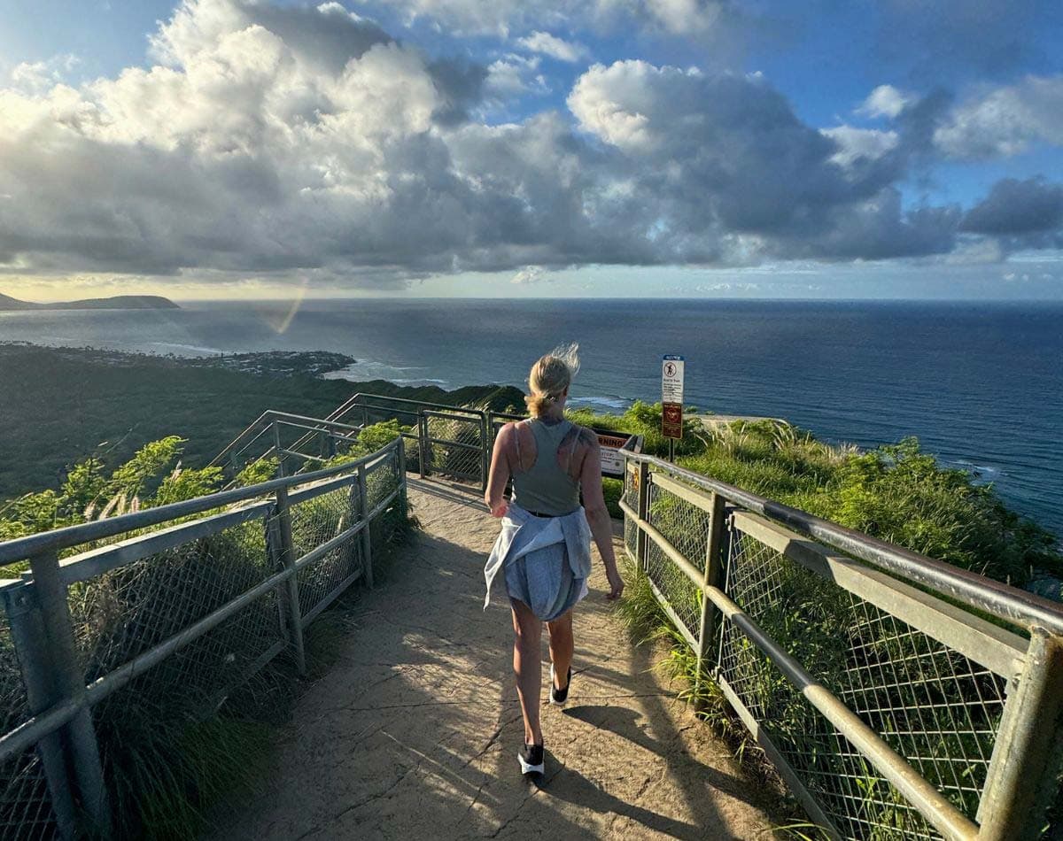 A Girl walking on top of the Diamond Head Crater on Oahu Hawaii.